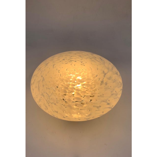 Table lamp with cylindrical base in chromed metal, hand-blown Murano glass diffuser with murrine effect in shades of white...