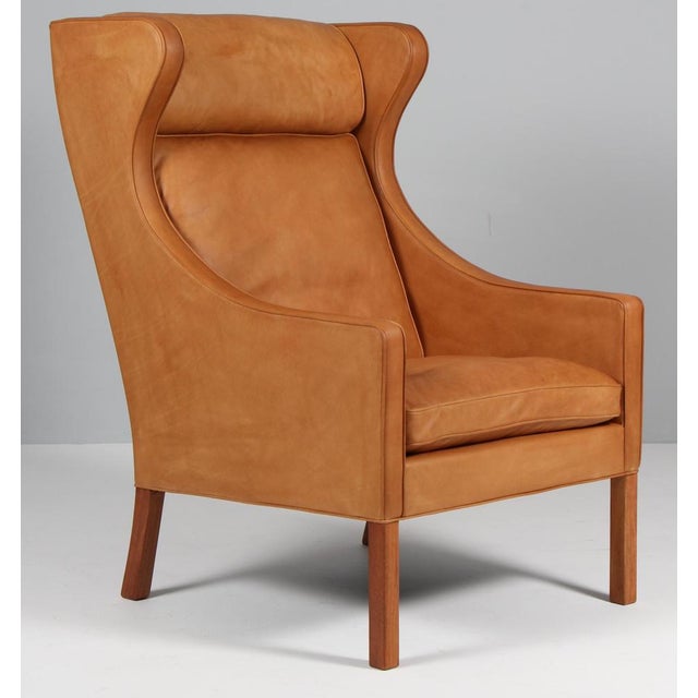 Børge Mogensen wingback chair newly upholstered with cognac vintage full grain aniline leather. Legs in teak. Model 2204,...