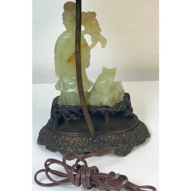 Chinese Carved Jadeite Guanyin with Cat, Mounted as a Lamp on French Bronze Base with Longevity Finial, Circa 1920, Two...