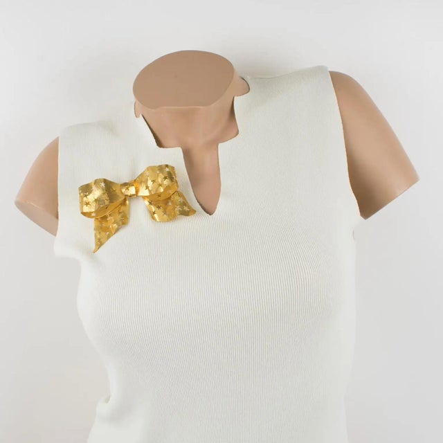 This stunning Sonia Rykiel Paris brooch features a massive, three-dimensional bow shape with gilt metal, all textured and...
