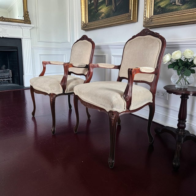 Pair of Louis XV style Fautieuil armchairs produced by Drexel Heritage, a respected American manufacturer known for...