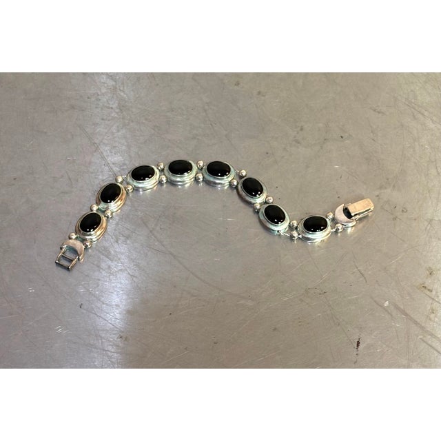 1960s-70s sterling silver/onyx link bracelet. Marked "Thailand 925" at clasp. Some mild signs of wear/use to metal...
