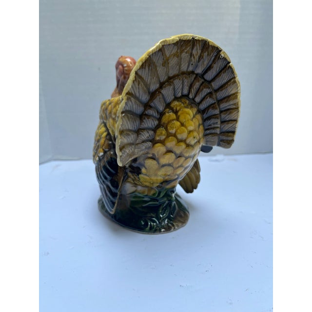 A single vintage ceramic turkey vase or cachepot with realistic colored decoration.