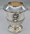 A beautifully crafted English silver plate champagne bucket in the classic Regency style — half-reeded body, decorative...