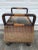 This is a beautifully decorated wicker chest with feet. It has a removable lid that fits tightly that can be easily...