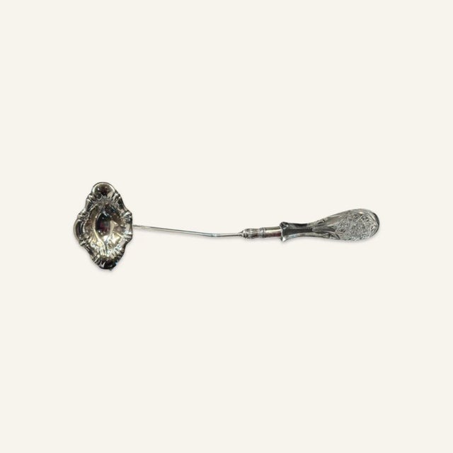 Circa 1950s punch ladle with metal stem and cut crystal handle. This punch ladle is in good original condition with a flea...