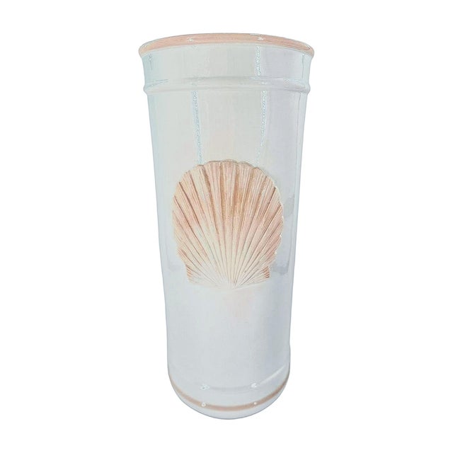 A vintage Italian ceramic umbrella stand produced for Lord & Taylor, featuring a softly sculpted shell relief against a...