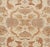 This palatial earth tone carpet is hand-knotted in Egypt by artisan rug weaver.