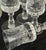 A squisita 1950s Italian hand-cut crystal set, etched with delicate mid-century motifs. Four goblets capture light with...