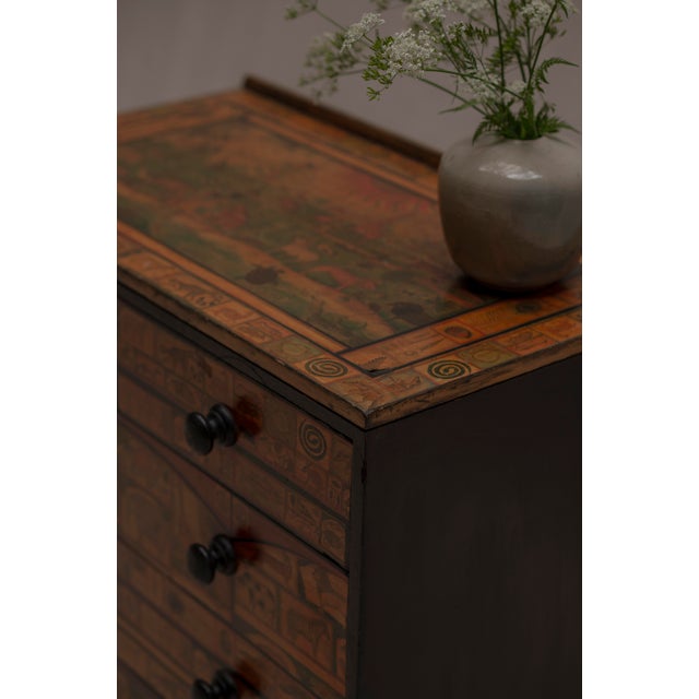 Unique vintage French mid-century chest of drawers, beautifully decorated with detailed miniature representations of...