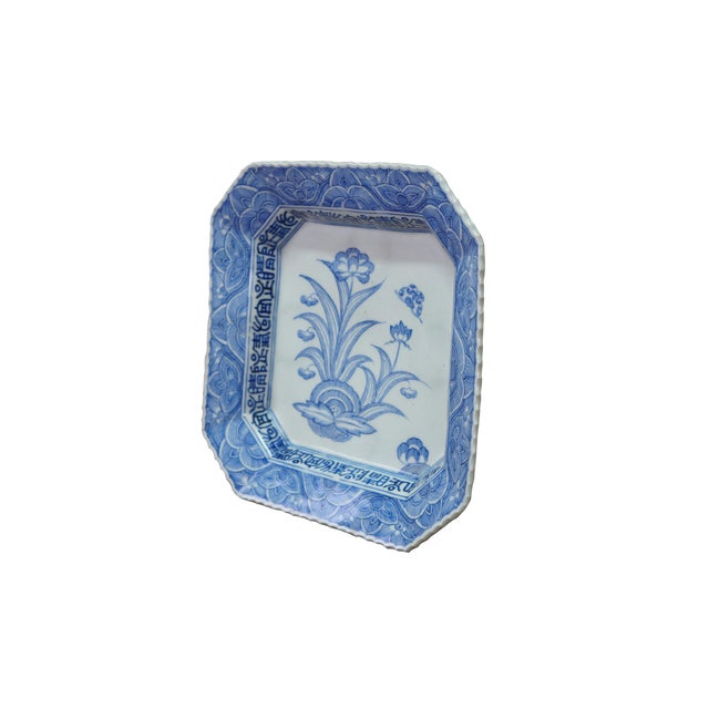 Impressive antique Japanese blue-and-white porcelain octagonal Imari plate with a scalloped, fluted rim. Hand-painted...