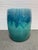 Design Plus Gallery presents a Ceramic Garden Stool with Ombre Glaze. This ceramic stool has a rounded cylindrical form...