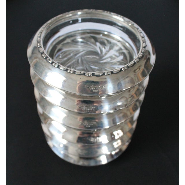 Set of six vintage sterling silver and glass drink coasters by Amston. Makers stamp on the side of each piece. Some age...