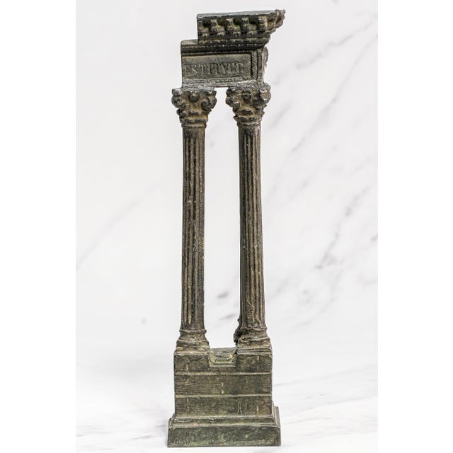 This striking Grand Tour model of the Temple of Vespasian and Titus captures the enduring majesty of ancient Rome in a...
