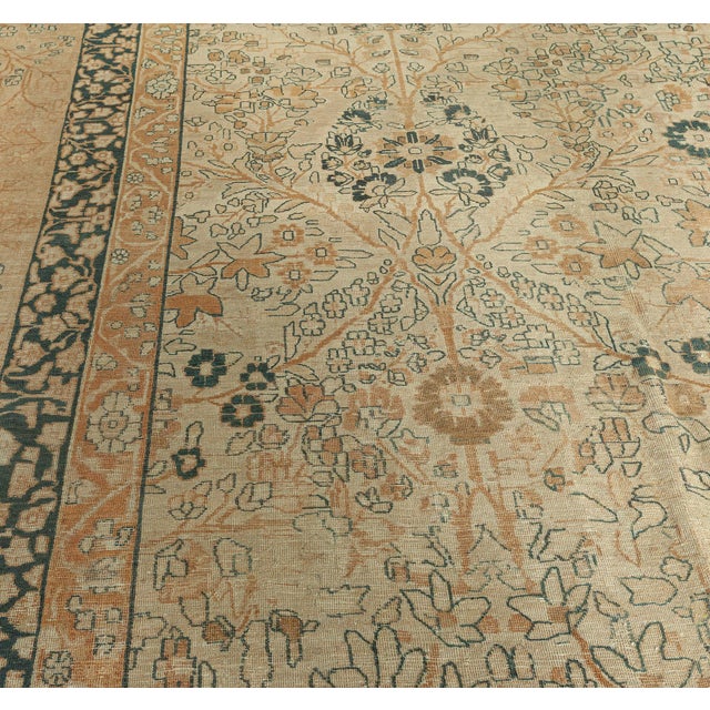A lovely example from the DLB gallerys collection of late 19th century Persian Kirman rugs, the cream field with a...