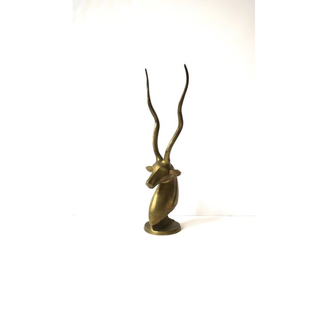 A brass animal Gazelle or Impala antelope animal bust sculpture decorative object with tall antlers, circa late-20th...