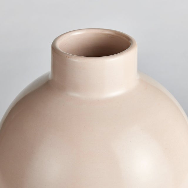 Made in Chulucanas, Peru this handcrafted ceramic vase is the product of warm climate, ancient Incan techniques, and an...