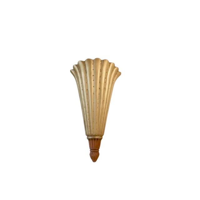 A striking Art Deco wall sconce in the form of a stylized palmette, its fluted fan rising from a turned and gadrooned...