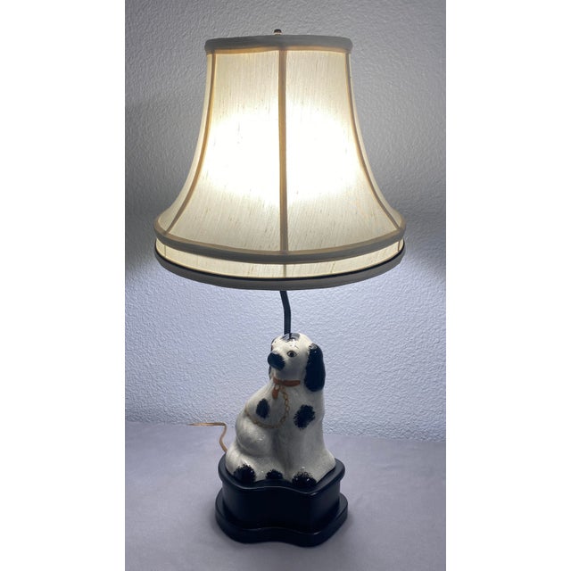 This vintage Staffordshire dog lamp by Frederick Cooper is in excellent condition. It comes with the original shade. This...