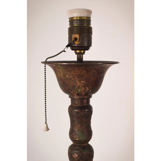 This grand standing lamp with a gilded effect is the perfect piece to incorporate some vintage character into your...