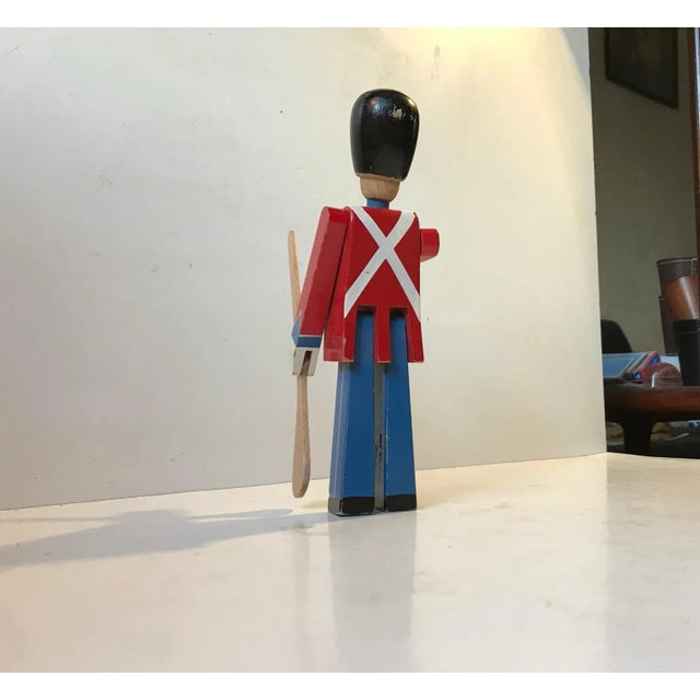 Wooden king's guardsman in lacquered beech. It was designed by Kay Bojesen in 1942. It features movable head, arms and...