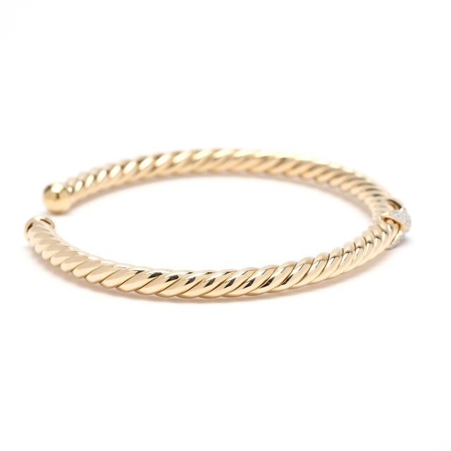 Stones: diamond round brilliant cut Circumference: 6 3/8 inches w/ 1/2 in. opening Width: 4 mm Weight: 5.9 dwts. / 9.1...
