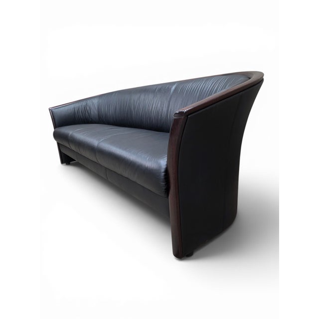 Vintage Ekornes Scandinavian Modern Black Leather Sofa with Rosewood Accents Vintage Norwegian modern three-seat sofa by...