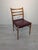 Danish Teak Chair from the 1960s This chair is made of exotic teak wood and is manufactured in Denmark. The seat is...