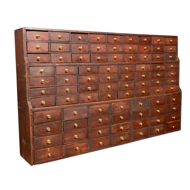 Having 87 drawers with brass knobs. Once used in a general store or apothecary. Shallow proportions.