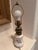 This piece is a classic vintage oil lamp that has been professionally converted to run on electricity. It features a...