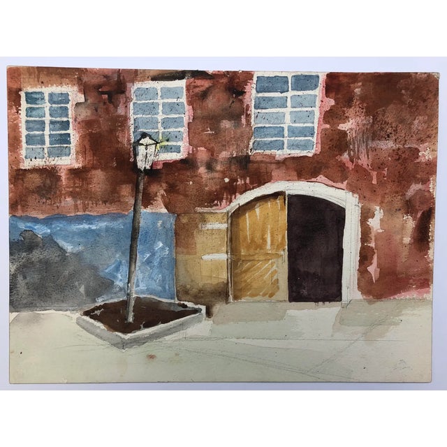 Watercolor on paper of a city street with a light post. Unsigned.