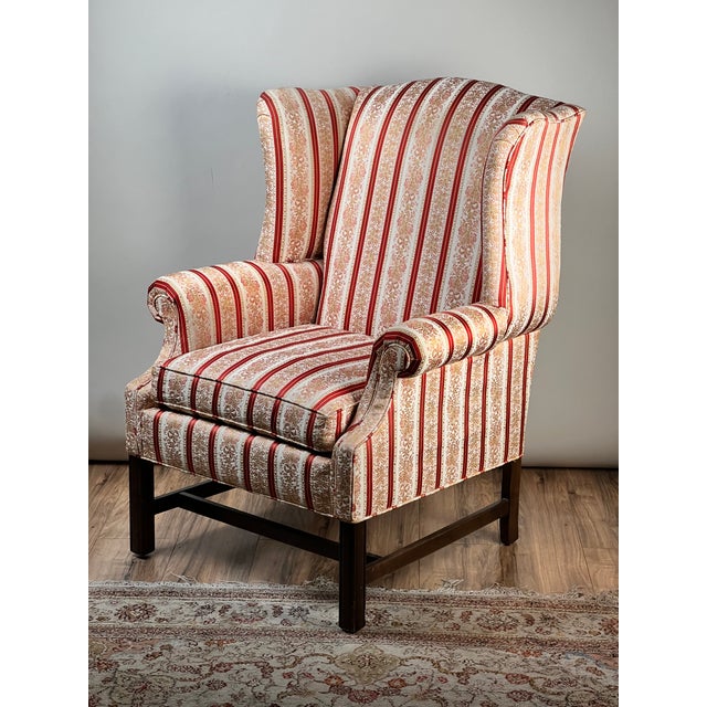 This is a really classic Chippendale-style wingback chair by Ethan Allen, a maker well known for producing high-quality...