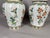 A decorative pair of mid-20th-century Chinese Famille Verte porcelain vases, hand-painted in the traditional Chinese...