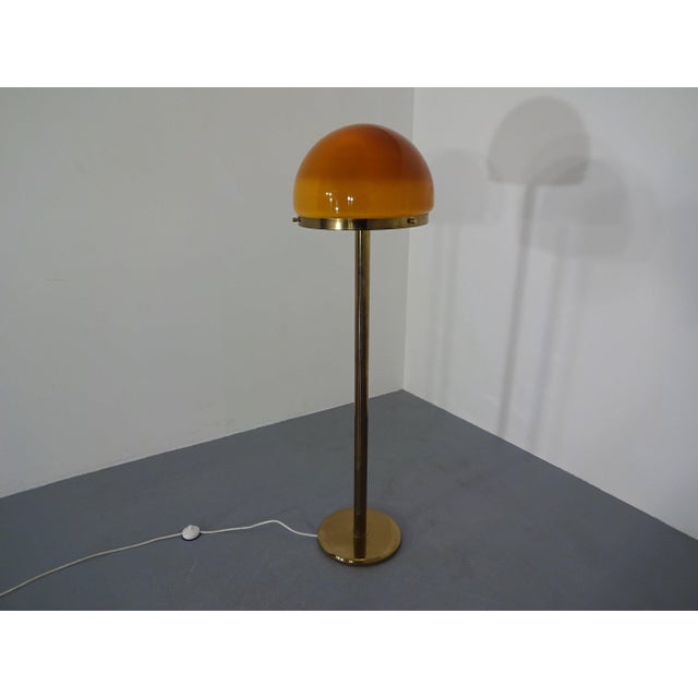 1960s floor lamp with brass stand and brown glass shade from Cosack Leuchten. I have official proof of authenticity such...
