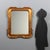 Gilded wood mirror. Moulded frame with engraved work. Italy, 20th century. This piece is attributed to the mentioned...