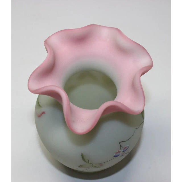 This exquisite Fenton Lotus Mist “Butterfly & Berry” ruffled vase showcases the timeless craftsmanship of Fenton Art...