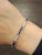This elegant tennis bracelet embodies modern sophistication, meticulously designed to highlight its timeless beauty....