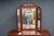 Thomasville mahogany dresser featuring a tri-fold mirror, brass hardware, and generous storage. This traditional-form...