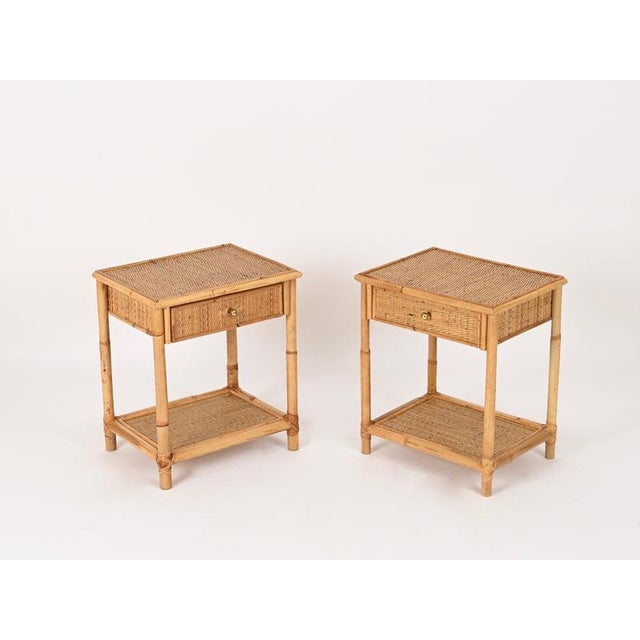 Delightful pair of Mid-Century nightstands crafted from bamboo and hand-woven rattan wicker, enriched with elegant solid...