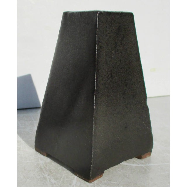 A very smart design in the style of its Arts and Crafts predecessors. Built-in slab technique with a gunmetal glaze. Fine...