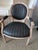 These elegant armchairs feature a classic French Louis XVI style design characterized by its iconic oval medallion back...