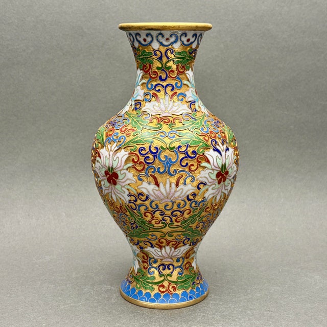 • Chinese cloisonné floral lotus vase. • Made in China, likely late 20th century. • Multicolor enamel with intricate gilt...