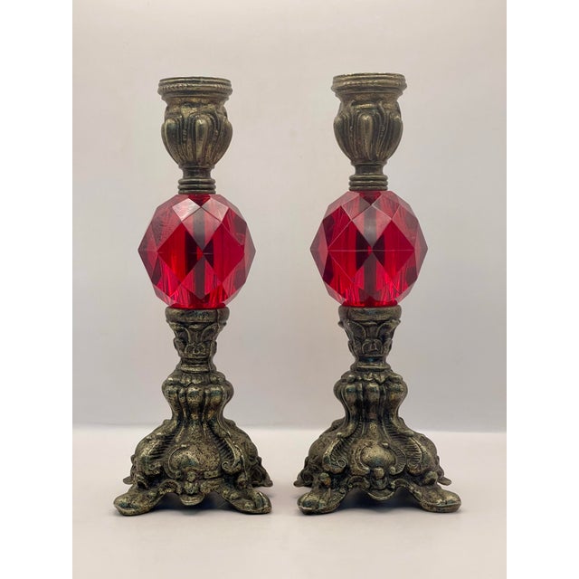 A striking pair of ruby & brass candlesticks in very good condition. Ships within 1-2 days using USPS. All items packed...