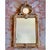 A fine Italian carved pine mirror with a carved and gilded gesso surface, dating to the early 19th century. The design has...