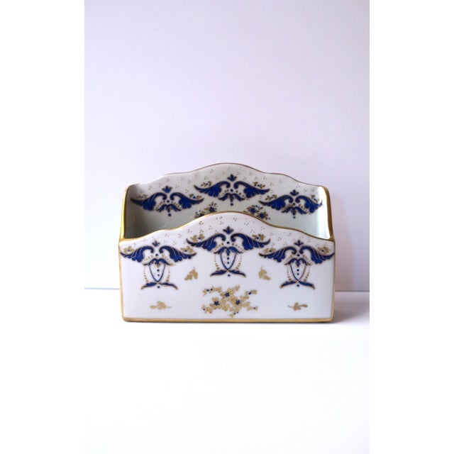 A French white porcelain desk letter or mail holder, with small flowers and leaves, in the Rococo design style, circa...