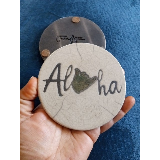GORGEOUS Pair of Signed Javier Gaytan Hawaii Raku 4" Coasters The product is a stunning pair of 4" coasters created by...