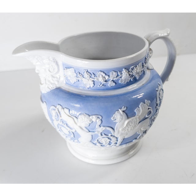 We are selling this pretty English Staffordshire pitcher by Ridgway.This pitcher has Neoclassical and Bacchus themed...