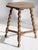 A small antique wooden stool with a hexagon top. The table is standing on three barley twist legs. Overall in good...