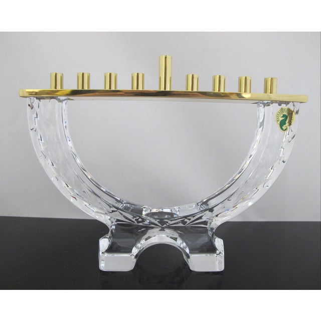 Waterford Crystal Menorah from the Chanukah Collection in cut crystal with polish brass candle holders. Comes in original...