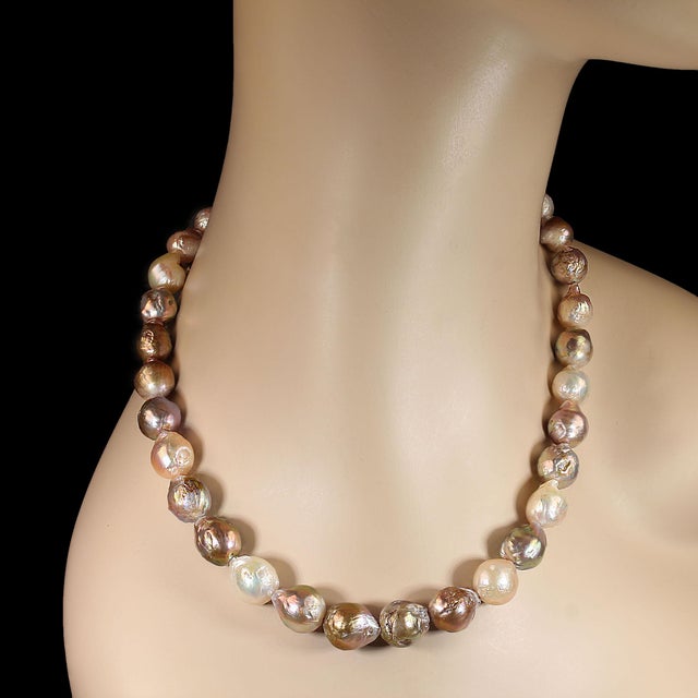 This 18‑inch baroque pearl necklace becomes a statement piece the moment it’s clasped around the neck. Each pearl is...